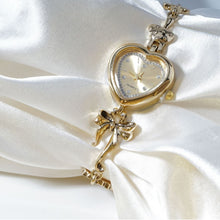 Retro Heart-shaped Bracelet Watch With A Golden Bow And Flower Design A Stylish Womens Timepiece
